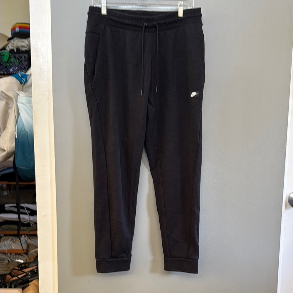 Nike Black Sweatpants with Tapered Fit and Cuffed Ankles